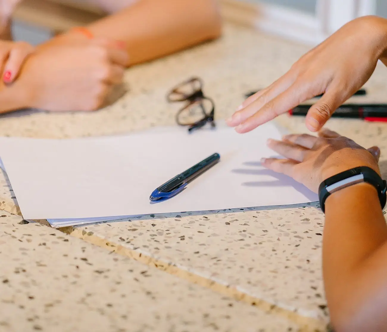 Two people reviewing a document together at a table