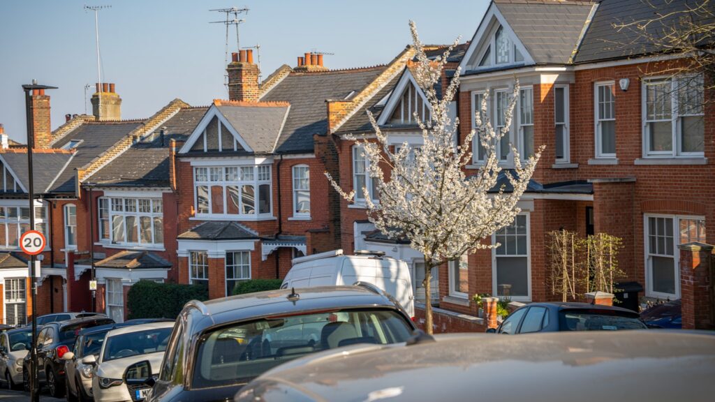 A row of London brick terraced houses, where the distance to a school gate can change from one year to the next.