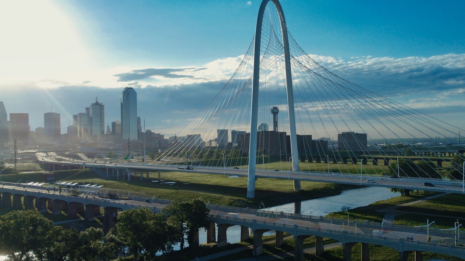 Sunrise over the Margaret Hunt Hill Bridge and the Dallas skyline, the setting for a look at the current education landscape in Dallas.