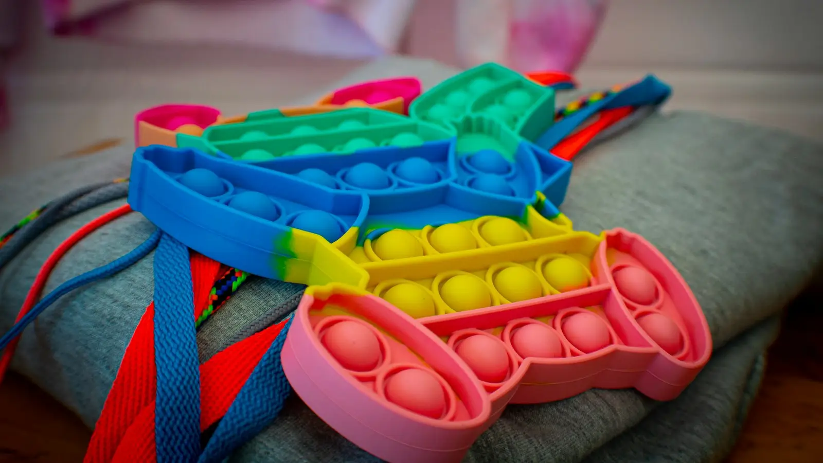 Colorful sensory fidget toys on a soft blanket